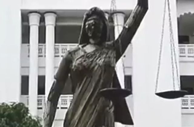 Statue of Lady Justice with scales and sword